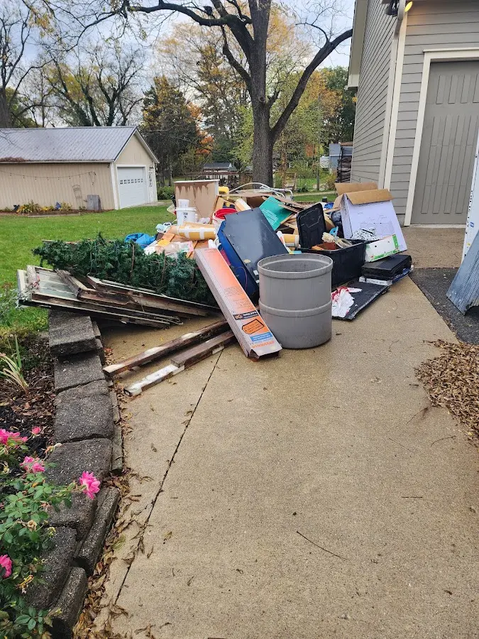 Dumpster being loaded with debris for Demolition Dumpster Rental in Woodville